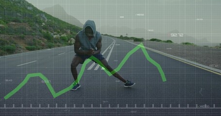 Stretching runner wearing hooded top lunging, checking phone on coastal road, green graph overlay