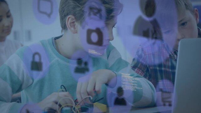 Boy in teal tee fixing wires, pal typing, purple icons overlaying laptop and sleeve for education
