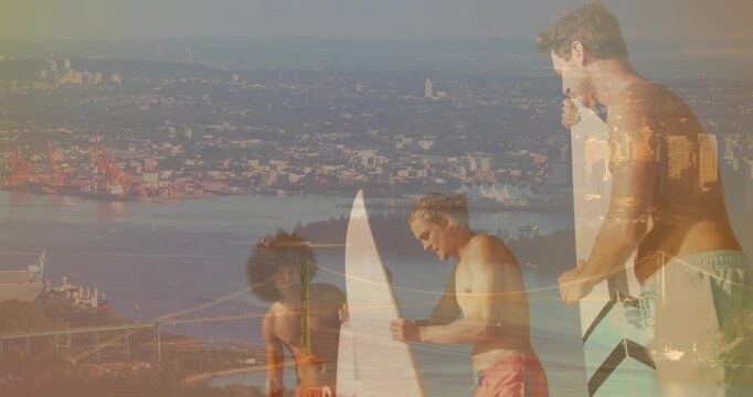 Three surfers pointing and inspecting board on bluff while city overlaying scene preparing to surf