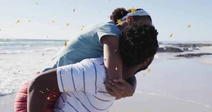 Woman hopping onto man's back, man supporting and walking shoreline, stars floating, travel romance
