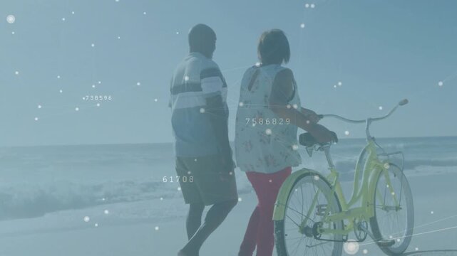 Pair starting shore walk, she pushing yellow bike, data overlay tracking motion for rest, tech