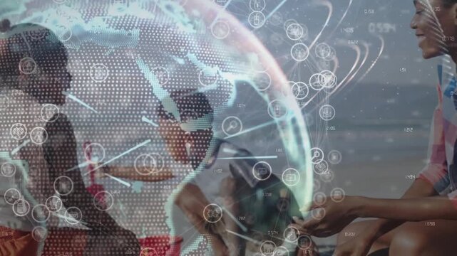 Kids gathering sand on beach, building with red pail for play, mom watching under tech overlay