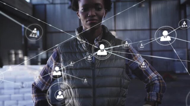 Woman in warehouse, user icon appearing on torso and growing network obscuring face for logistics
