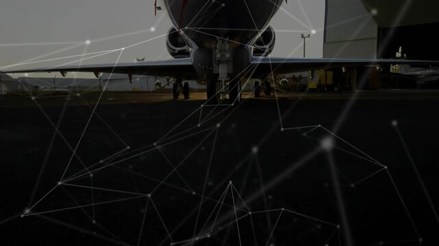 Network moving, camera rising, jet nose revealing while cockpit and hangar appearing for repair