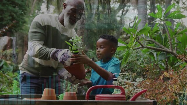Senior man presenting seedling to boy, guiding transplant into terracotta pot, teaching gardening