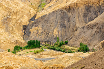 Beautiful scenic view of Moonland, near Lamayuru, named for its uncanny resemblance to the surface of the Moon. Naturally eroded, soft clay hills giving it a true lunar vibe. Lamayuru, Ladakh, India.