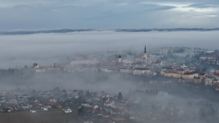 TABOR town aerial panorama with morning fog rising above historic city and surrounding landscape.
