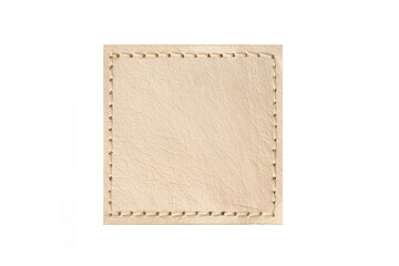 Beige leather patch with stitched border isolated on light background. Square blank label texture....