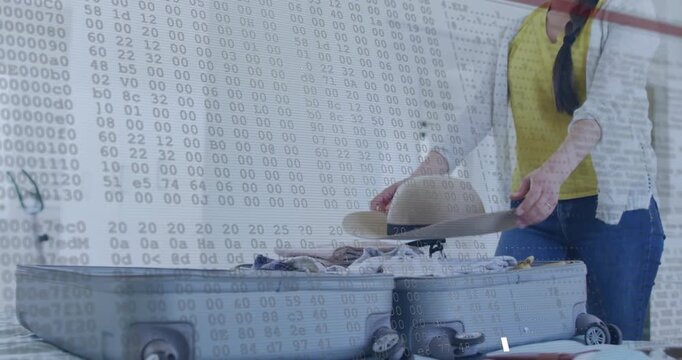 Woman preparing suitcase for travel, placing hat, smoothing clothes with code overlay responding