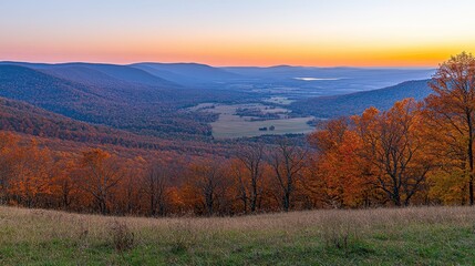 Fototapeta premium Vibrant Autumn Sunrise Over Mountain Valley Landscape with Expansive Horizon and Colorful Foliage