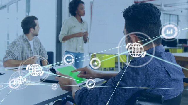 Man in wheelchair tapping tablet at business, network overlays growing, linking icons for data