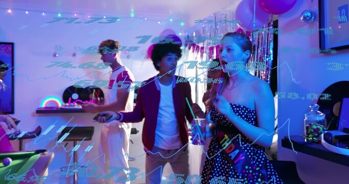 Celebrating woman in strapless polka-dot dress, birthday sash mingling in rec room by pool table