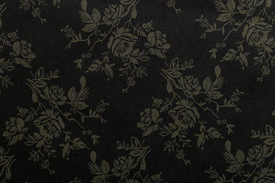 Floral pattern design on dark background suitable for textile or wallpaper use in home decor projects