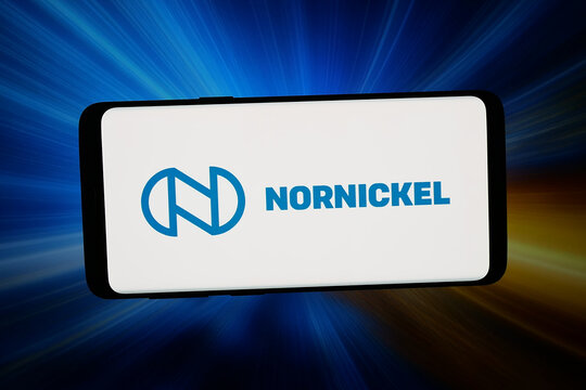 Stuttgart, Germany - 02-25-2026: In this photo illustration, the logo of company OJSC MMC Norilsk Nickel (Nornickel) is displayed on a smartphone in front of abstract background on computer screen.