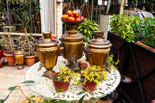 traditional antique metal samovar. Water boils in a samovar outside for brewing tea.