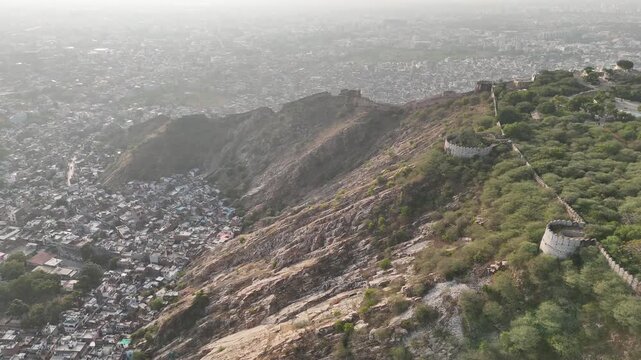 4K aerial video flying along Nahargarh Fort overlooking Jaipur, Rajasthan, India.