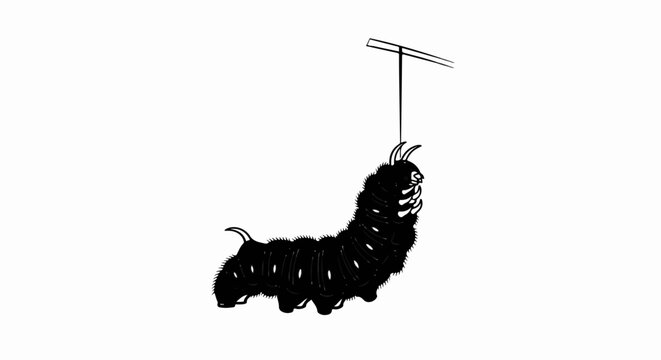 A fuzzy black caterpillar hangs from a thin line attached to a T-shaped bar