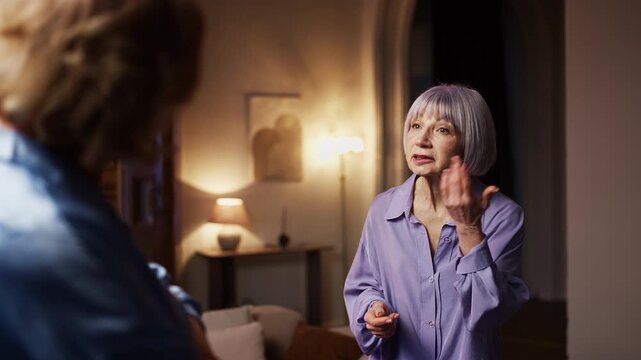Irritated senior woman arguing with her female friend, distrust in relationship