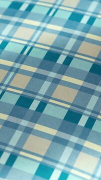 Blue and Teal Plaid Pattern Background with Subtle Movement, Soft Moving Plaid Surface for Social Media and Stationery Backgrounds, vertical video