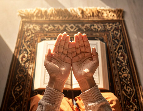 hands in a prayer with holy book 