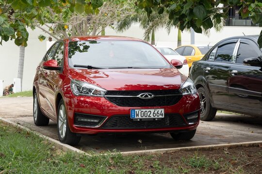 Red Chery Arrizo 5 Chinese car parked in Cuba