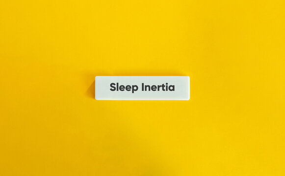 Sleep Inertia Typography Concept on Yellow Background for Sleep Science Morning Grogginess and Circadian Rhythm Education