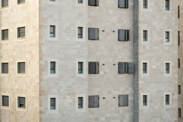 Obraz premium Residential building facade featuring reinforced metal security shutters