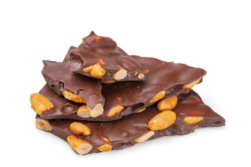 A pile of dark chocolate pieces isolated on a white background.