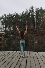 Fototapeta premium Tourist with raised hands on a beautiful background.