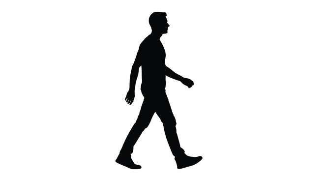 A solitary man is captured in mid stride walking forward with a relaxed posture presented as a striking silhouette