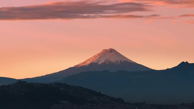 At sunrise, Quito, Ecuador, Cotopaxi volcano stands majestically against the sky.