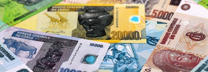 CFA franc money bills pile on table. Republic of the Congo banknotes of XAF currency close up.