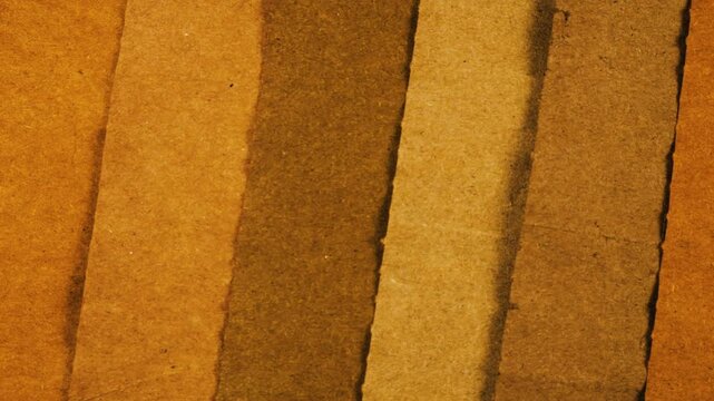 Natural kraft paper texture with handmade herbal dye in yellow and brown shades. Eco-friendly recycled material background for junk journal or scrapbooking creativity.
