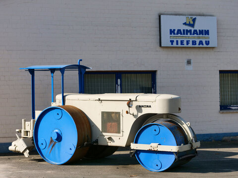 Germany, H&ouml;velhof, February 27. 2026, Kaimann Tiefbau entrance with a historic Hatra road roller
