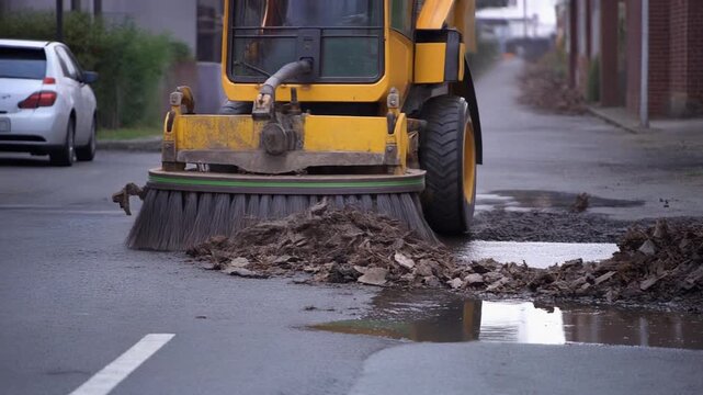 Street Sweeper Cleaning Leaves from Road.