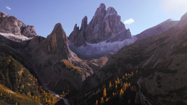  Croda dei Toni mountain peak in Dolomites and golden larch trees