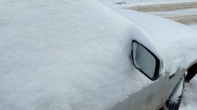 Frozen Car Side Mirror Iced Over, Heavy Frost Patterns On Window And Door In Suburban Courtyard, Early Morning Blue Light, Textured Crystal Formations, Silent Cold Atmosphere Suggesting.