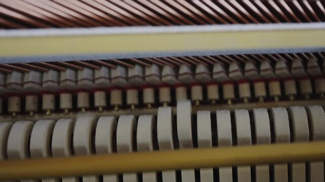 Close examination of piano hammer striking felt and its impact on strings