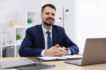 Fototapeta premium Portrait of notary at wooden desk in office
