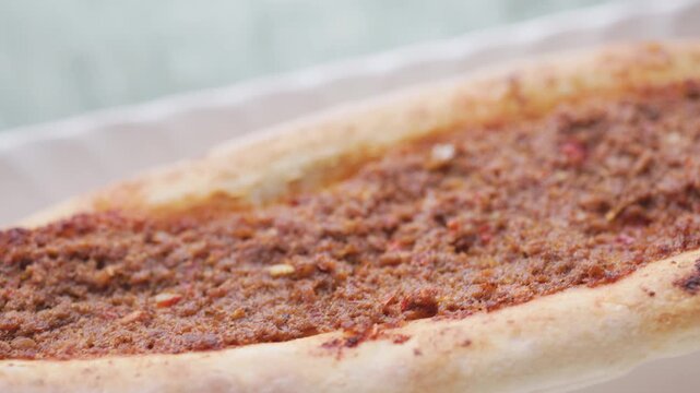 Close-Up of Traditional Turkish Pide with Meat and Cheese