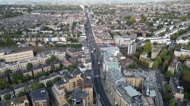 Aerial view of traffic and life on Kilburn High Road, London, capturing the local Marriott Hotel and infrastructure in the borough of Brent.