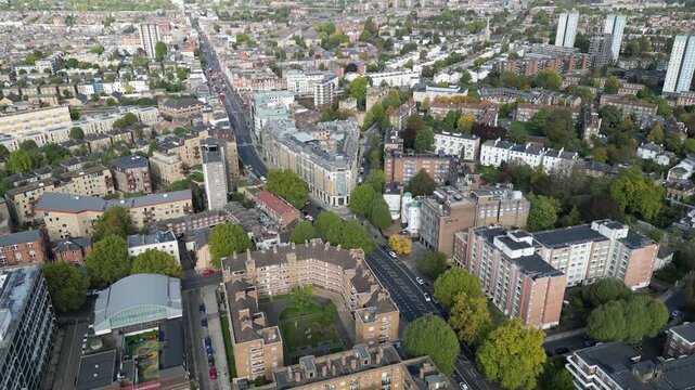 Aerial view of traffic and life on Kilburn High Road, London, capturing the local Marriott Hotel and infrastructure in the borough of Brent.