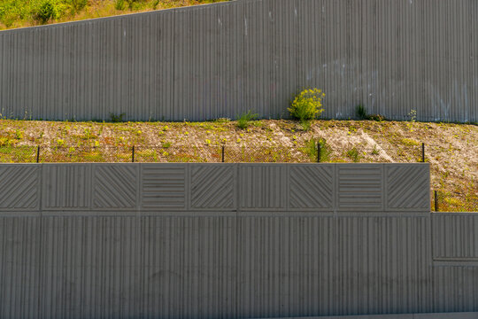 USA, Washington State.  Decorative cement retaining wall beside US Interstate highway 5.