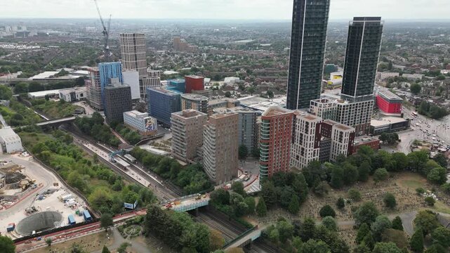 Aerial view of residential skyscrapers and Imperial College London in White City, West London, showcasing ongoing urban regeneration.