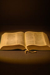 Fototapeta premium Open Bible in warm light with copy space
