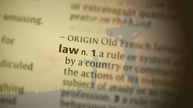 Blurry dictionary text drifting starting focus shift crucifix staying as letters resolving into law