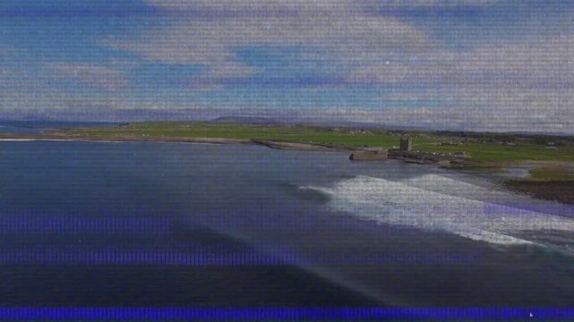 Camera panning, coastline revealing headland and tower while swells breaking, revealing shoreline
