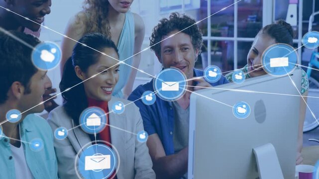 Coworkers pointing at screen, launching moving envelope and user icons around team for business
