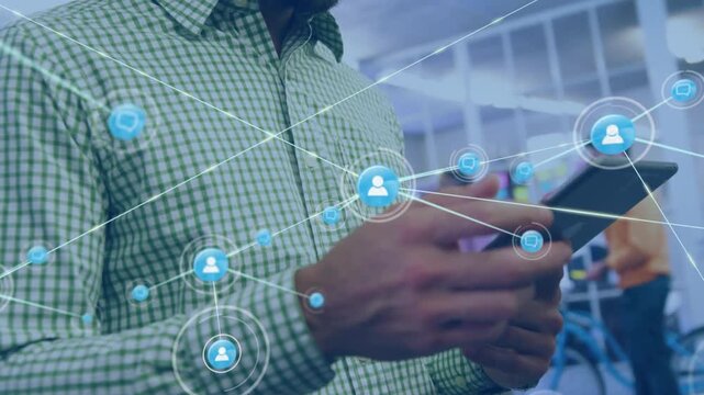 Man tapping tablet, activating blue network icons and lines in tech workspace showing file sharing
