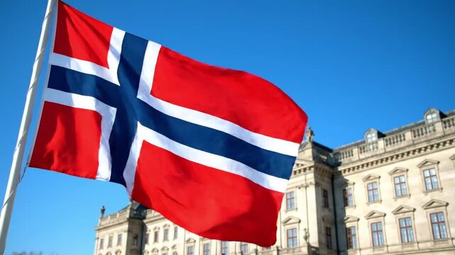 Norwegian flag waving in front of a historical building on a clear day